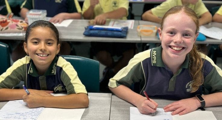 two students working in class