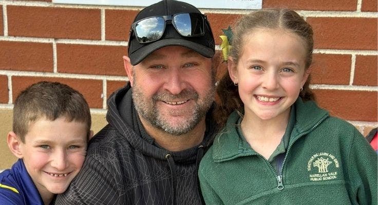two students with their dad on fathers day celebration day