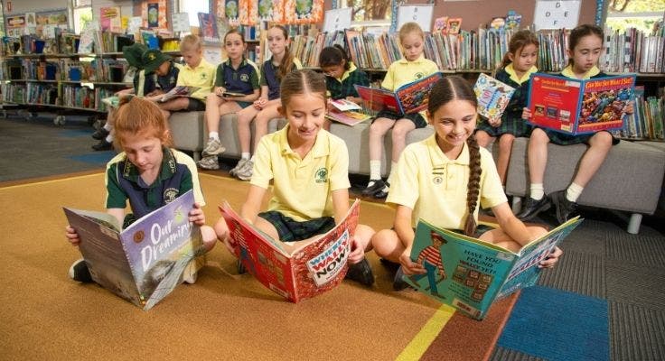 students reading in the library